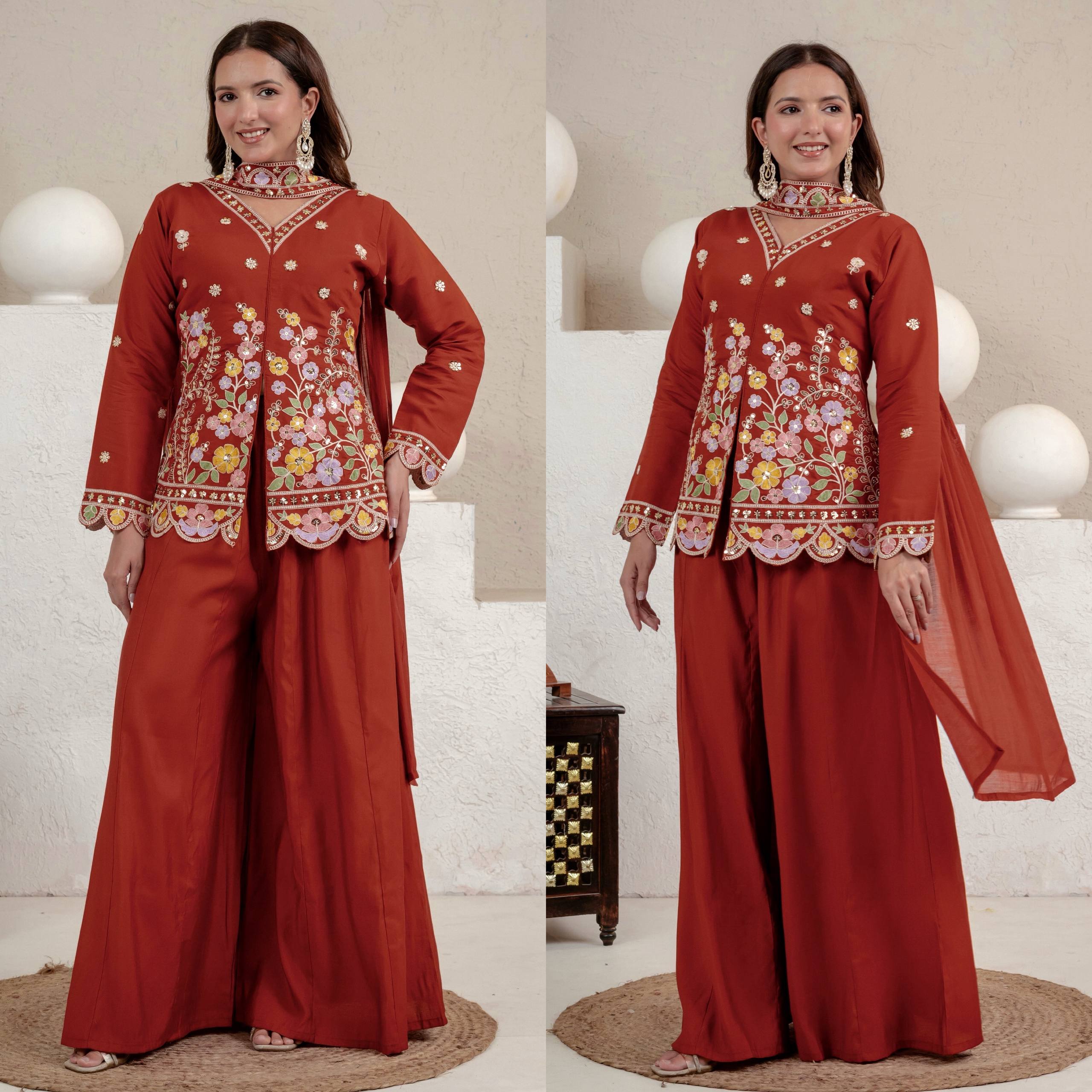 Resplendent Rust Orange Peplum Kurti and Flared Palazzo Suit Set Adorned with Intricate Multicolored Floral Embroidery, Sequin Accents, and Ornate Scalloped Borders